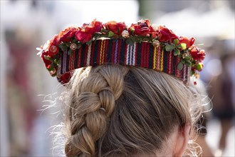 Riga. Ligo Festival. Folk dance on the town square. Headdress of a young woman with a wreath of