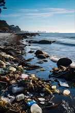 Coastal shoreline strewn with plastic waste post high tide impacting aquatic ecosystems, AI