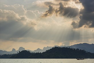 Limestone rocks in the evening light in Cheow Lan Lake in Khao Sok National Park, evening, sunset,