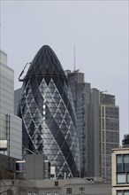 The Gherkin skyscraper building and nearby high rise office building, City of London, England,