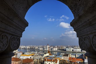 View through the facade of the Fisherman's Bastion to the Danube and the Parliament, politics, city