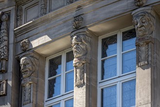 Allegorical reliefs, heads for wit, malice, mockery, Giessen City Theatre by architects Fellner &