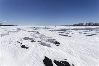 Winter, snow drifts on frozen riverscape, Saint Lawrence River, Province of Quebec, Canada, North