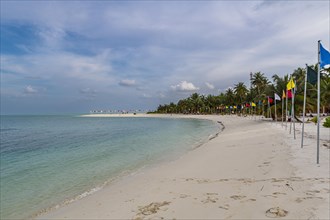 White sand beach with many flags, Bangaram island, Lakshadweep archipelago, Union territory of