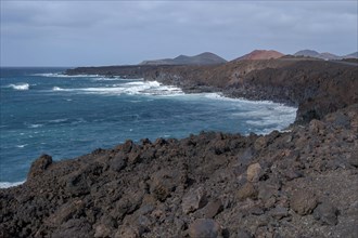 Lava rocks in the sea, surf, near Los Hervideros, Lanzarote, Canary Islands, Spain, Europe