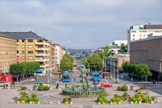 City view of the Avenyn with a water fountain and buses and cars on the city street in Gothenburg,