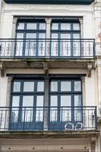 Historic facade with blue balconies and white window frames, built in 1898, Blankenberge, Flanders,