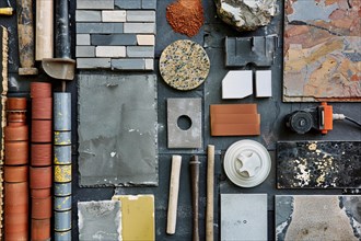 Various construction materials and tools neatly arranged, showcasing an array of textures and