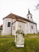 Stone sculpture, St Bartholomew, behind the Roman Catholic parish church of St Nicholas, Stubenberg