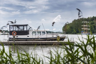 Houseboat on a lake, boat, ship, seafaring, water, freshwater, boat trip, boat excursion, form of