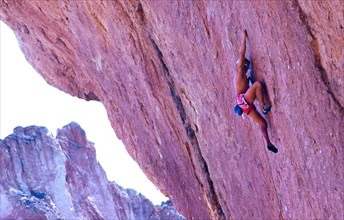 Climber on a route of the seventh or eighth degree of difficulty on the German scale, Smith Rocks