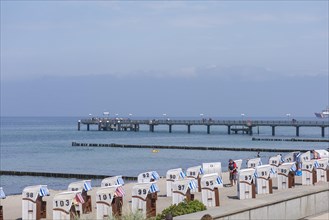 Beach chairs and pier in Kuehlungsborn, Mecklenburg-Vorpommern, Germany, Europe