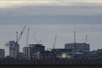 Industrial cranes across the skyline, City of London, England, United Kingdom, Europe