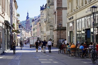 Sunny day in a busy city street with pedestrians and cafes, Heidelberg, Baden-Wuerttemberg,