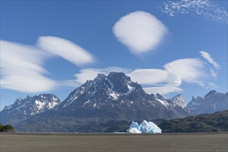Iceberg and mountain backdrop, Lago Grey, cloud splendour, Torres del Paine National Park, Parque