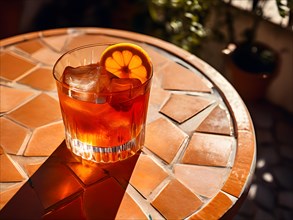 Aperol spritz radiating bright and bubbly charm glass positioned on a sunlit terrace table, AI