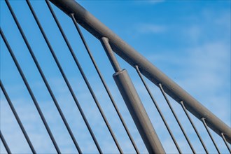 Detail of a curved bridge railing in front of a clear blue sky, Oberhausen, North Rhine-Westphalia,