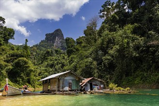 Inhabited huts in Cheow Lan Lake in Khao Sok National Park, locals, live, nature, travel, holiday,