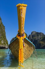 Longtail boat at Maya Bay, boat, wooden boat, ferry boat, ferry, passenger ferry, decorated, faith,