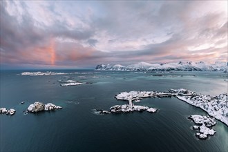 Snow-covered mountains by the fjord and islands, Bergsfjorden, Hamm i Senja, Senja Island, Norway,