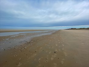 Quiet beach with a wide sandy area and a large skyline, DeHaan, Flanders, Belgium, Europe