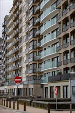 Modern residential buildings with balconies and traffic signs prohibiting entry, Blankenberge,