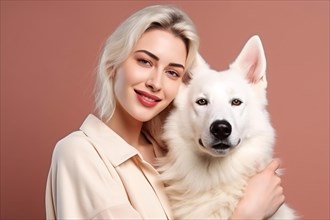 Young woman hugging white Shepherd dog in front of peach colored studio background. KI generiert,