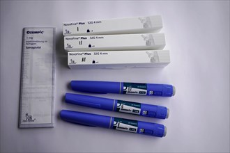 Several Ozempic injection pens and needles on white background, for diabetes 2 patients, Stuttgart,