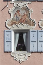 Window in a historic house with Lueftlmalerei in Ludwigstrasse, Partenkirchen district,