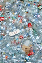 Numerous discarded plastic bottles create an environmental pollution problem, editorial
