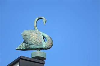 Mute swan sculpture on the roof of the Schwanberg monastery, Casteller Ring community, bronze,