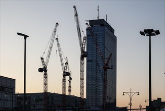 Cranes at the construction site of the Covivio high-rise, next to the Park Inn by Radisson Berlin