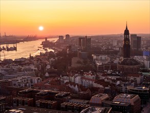 Aerial view of St. Michael's Church (Michel) with harbour and Elbe at sunset, Hamburg, Germany,