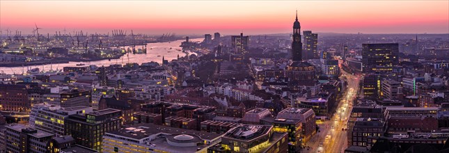 Panorama aerial view of St. Michael's Church (Michel) with harbour and Elbe at sunset, Hamburg,