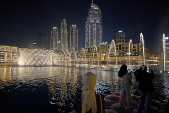 The Dubai Fountain water features on Lake Burj Khalifa. Dubai, United Arab Emirates, Asia