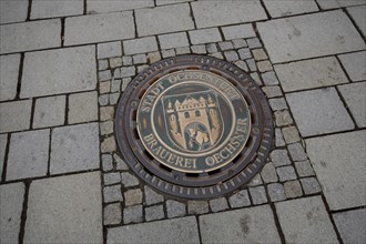 Manhole cover with inscription brewery, town, ground, round, main street, Ochsenfurt, Lower
