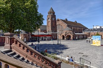 Historic Wilhelmine railway station, staircase, clock tower, reception building, neo-Romanesque and