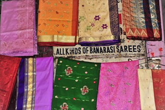 Colourful selection of saris with different patterns at a market, Varanasi, Uttar Pradesh, India,
