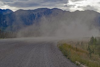 Long plume of dust on a gravelled section of the Alaska Highway, Yukon Territory, Canada, North