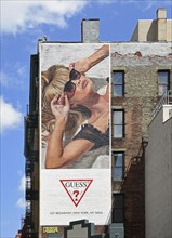 Hand-painted mural, woman with sunglasses, advert for GUESS, SoHo district, Manhattan, New York
