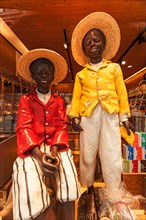 Two coloured mannequins in a Dutch cocoa parlour