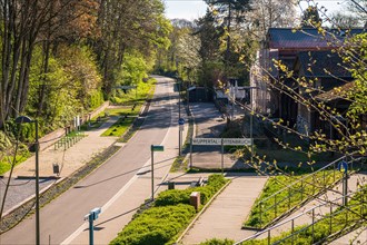 Sunny spring view of a street in a residential area with a clear sky, cycle path, Nordbahntrasse,