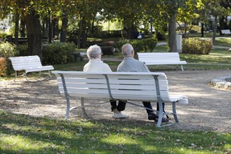 A retired couple sitting on a bench in a park in Bad Harzburg, 06.10.2018