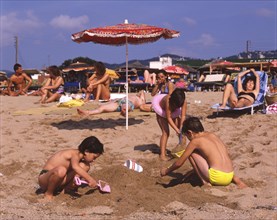 Children playing on the beach in Calella, Costa Brava, Barselona, Catalonia, Spain, Southern Europe