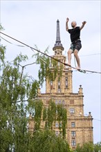 Riga. Alternative cultural centre near the Latvian Academy of Science. Tightrope walker on the
