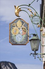 Old, decorated hanging sign of the Werdenfelser Hof inn in Ludwigstrasse, Partenkirchen district,