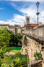 Ponte del Diavolo from the 15th century leads over the Natisone river into the historic centre,