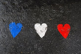 Hearts on pavement in the French national colours, Paris, Ile de France, France, Europe