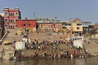 People gather at a busy stretch of stairs by the river, Varanasi, Uttar Pradesh, India, Asia