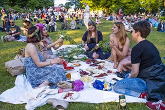 Riga. Ligo festival in Dzeguzkalna Park. Girlfriends with a big picnic, Riga, Latvia, Europe
